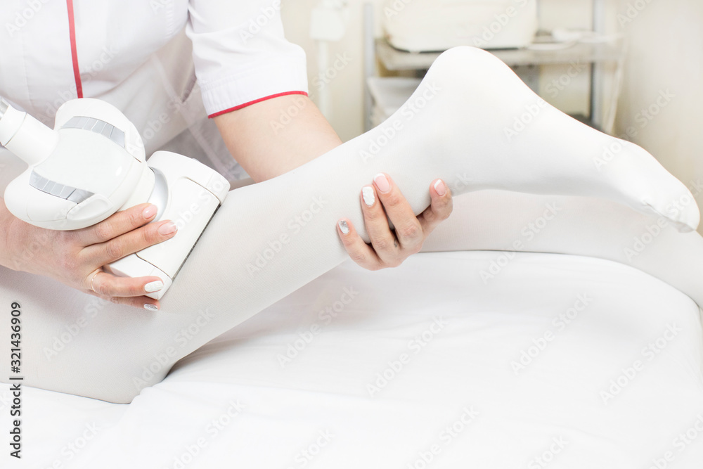 Young Woman is in the process at the clinic lipomassage. Young Woman is in the process at the clinic lipomassage.