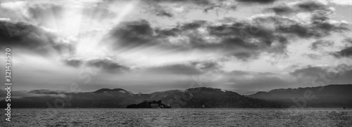 Panoramic view of Alcatraz Island and San Francisco coastline dat sunset, California, USA