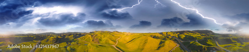 New Zealand Countryside aerial view. Hills and vegetation with storm