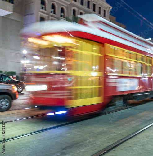 City streets at night with tram in New Orleans