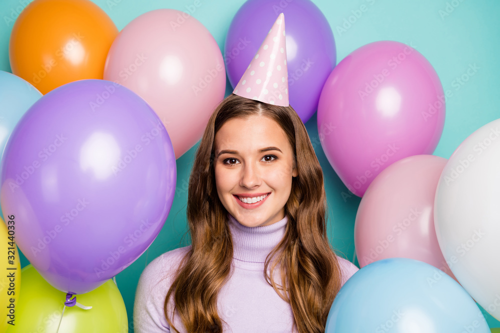Photo of pretty funny birthday lady surrounded by many colorful air balloons best holiday ever wear paper event cap lilac pullover on teal color background