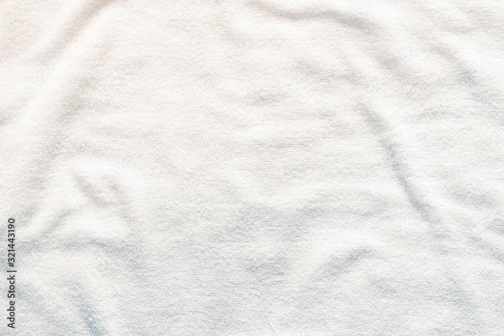 White towel texture background with abstract pattern. That fabric or textile consist of cotton fiber or natural material. For absorb water, drying and wiping in bathroom, laundry and kitchen room. White towel texture background with abstract pattern. That fabric or textile consist of cotton fiber or natural material. For absorb water, drying and wiping in bathroom, laundry and kitchen room.