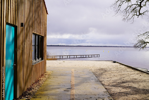 wood access empty pontoon sand beach on Lake Hourtin in Gironde france photo