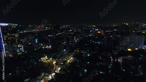 Wallpaper Mural Ho Chi Minh City aka Saigon, Vietnam, showing landmark buildings and traffic at night. Torontodigital.ca