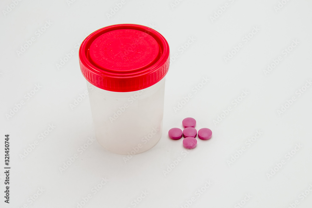 jar for analysis, pills on a white background jar for analysis, pills on a white background