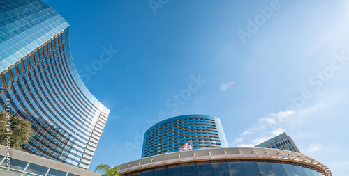 Modern buildings with trees and blue ky. Business concept