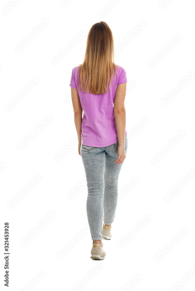 Young woman posing on white background, back view Young woman posing on white background, back view
