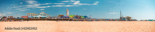 SANTA MONICA, CA - AUGUST 1, 2017: Panoramic view of city pier with tourists and locals