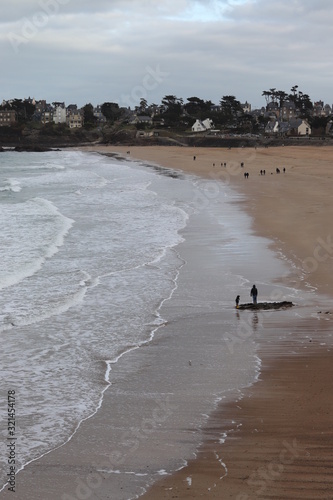 French beach with people and waves