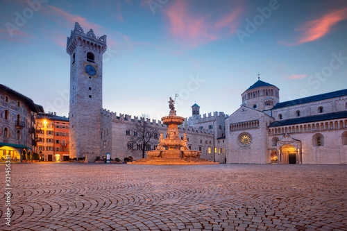 Trento, Italy. Cityscape image of historical city of Trento, Trentino, Italy during twilight blue hour. photo