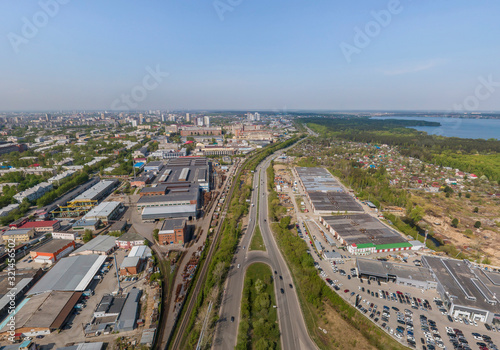 Industrial area, gardens and Shartash lake in Yekaterinburg city, Russia. Aerial, summer, sunny