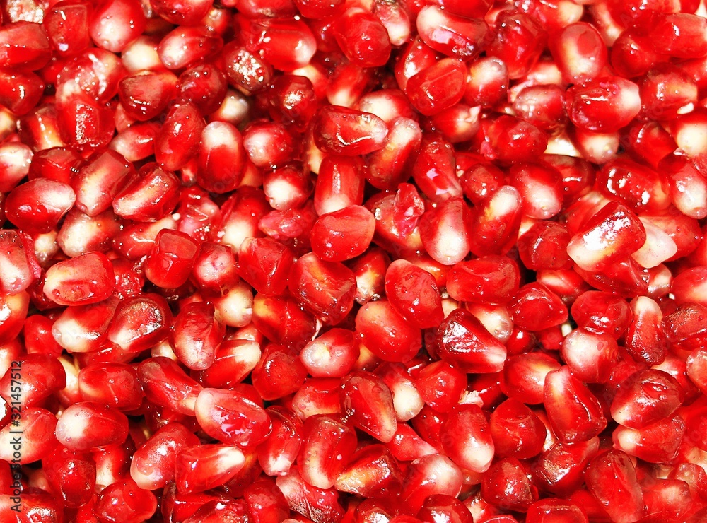 Red background from ripe fresh pomegranate seeds Red background from ripe fresh pomegranate seeds