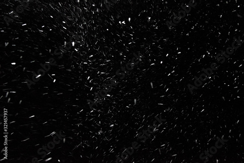 Texture of falling snow at night