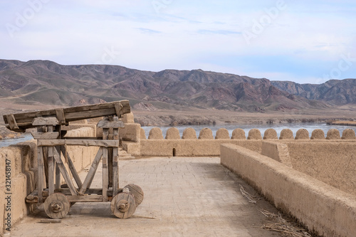 Restored medival siege weapon on the fort wall photo