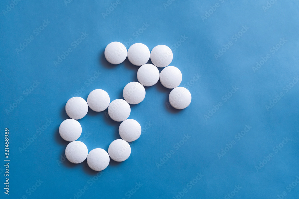 Male sign made of white round pills. Men's health cure concept. Abstract design element. Graphic element. Pills background.