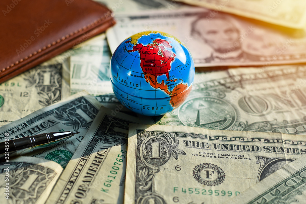 Close-up view World map on money dollars, Concept Economic Stability Of The World. Close-up view World map on money dollars, Concept Economic Stability Of The World.