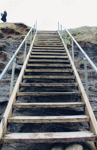 Fototapeta Naklejka Na Ścianę i Meble -  Stairs from beach to cliff