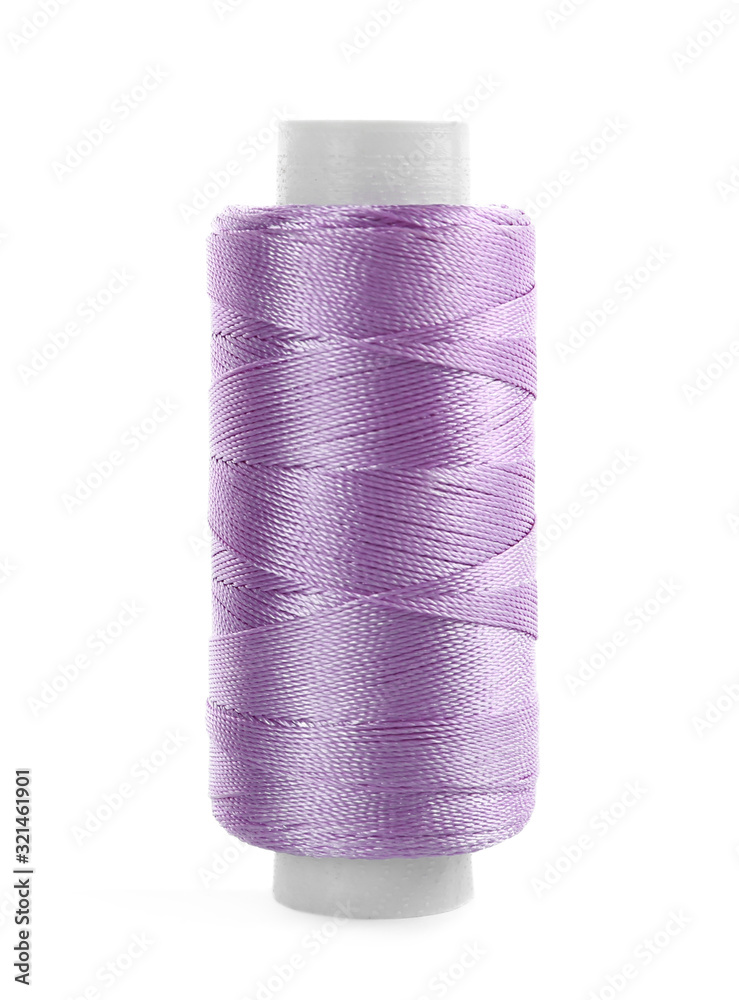 Spool of violet sewing thread isolated on white Spool of violet sewing thread isolated on white