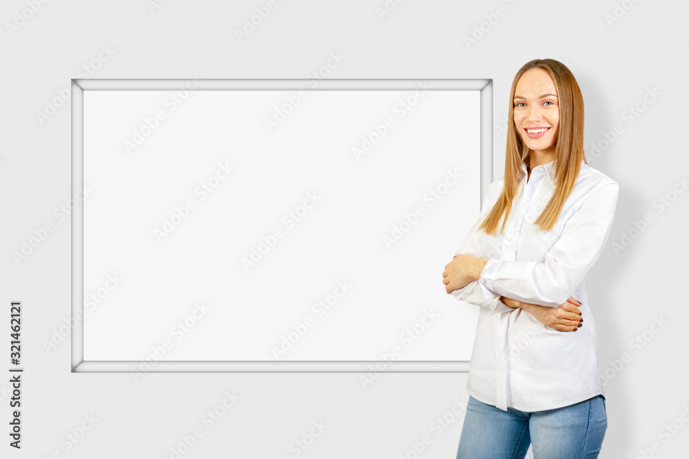 Young businesswoman making presentation project on a white board. Mock up. Young businesswoman making presentation project on a white board. Mock up.