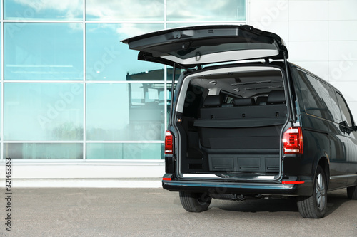 Obraz na plátně Modern car with open empty trunk outdoors