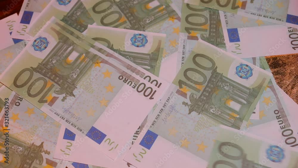 Close-up of 100 euro bills on the table. Close-up of 100 euro bills on the table.