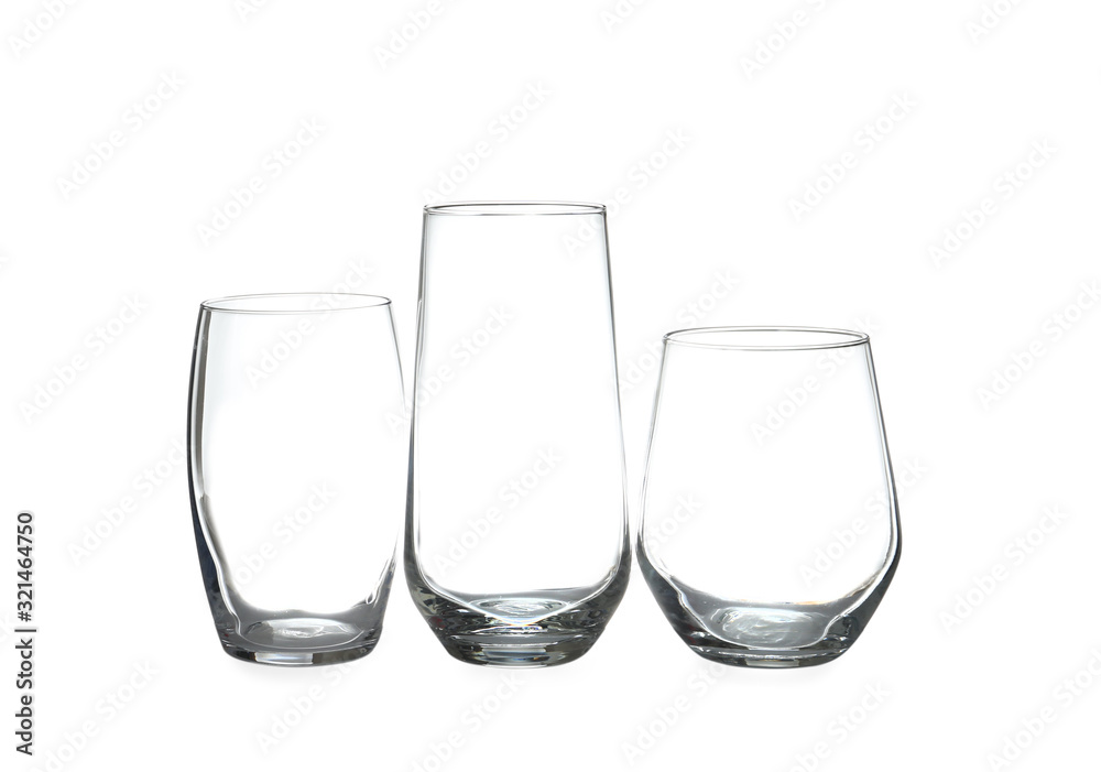 Set of different clean empty glasses isolated on white Set of different clean empty glasses isolated on white