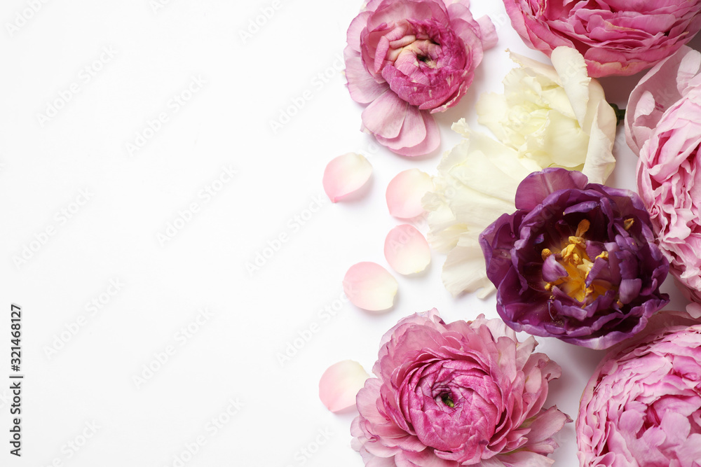 Composition with beautiful flowers on white background, top view. Floral card design