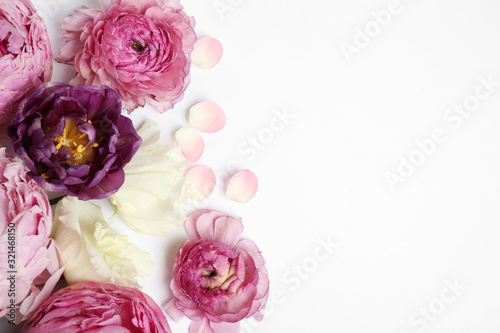 Composition with beautiful flowers on white background, top view. Floral card design