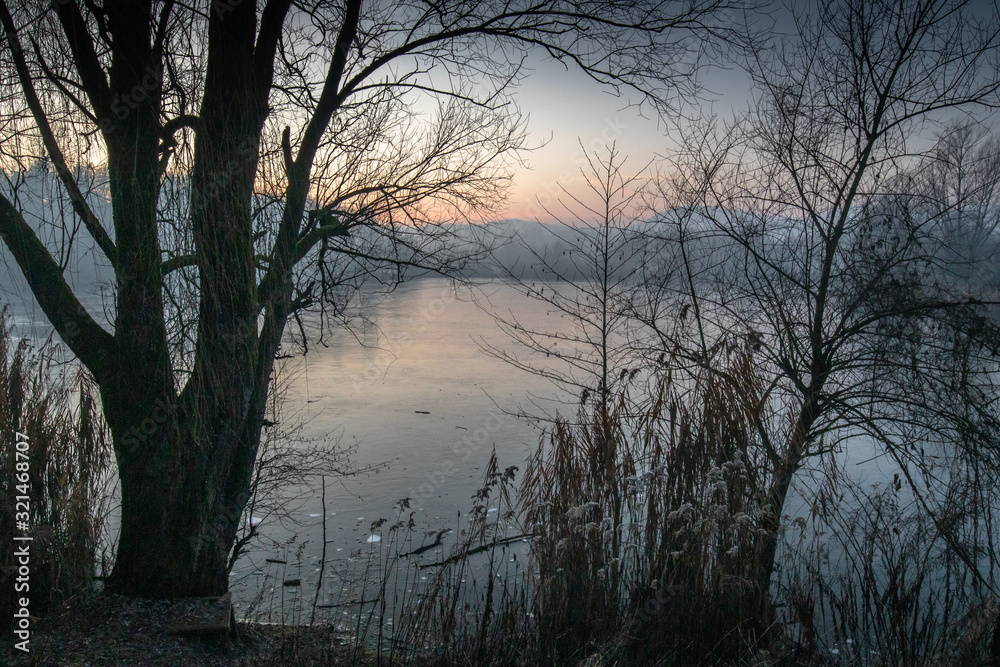 beautiful view on a frozen lake in winter season in beautiful sunset and mountains beautiful view on a frozen lake in winter season in beautiful sunset and mountains