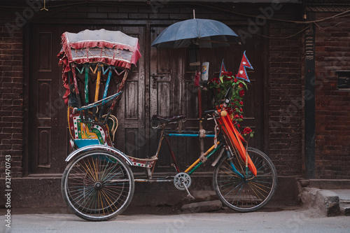 Colorful traditional rickshaws parked in the streets of Thamel district in Kathmandu city, Nepal