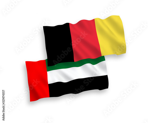 National vector fabric wave flags of United Arab Emirates and Belgium isolated on white background. 1 to 2 proportion.