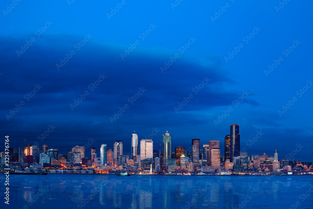 Seattle waterfront downtown buildings wide skyline view at night, Washington, USA