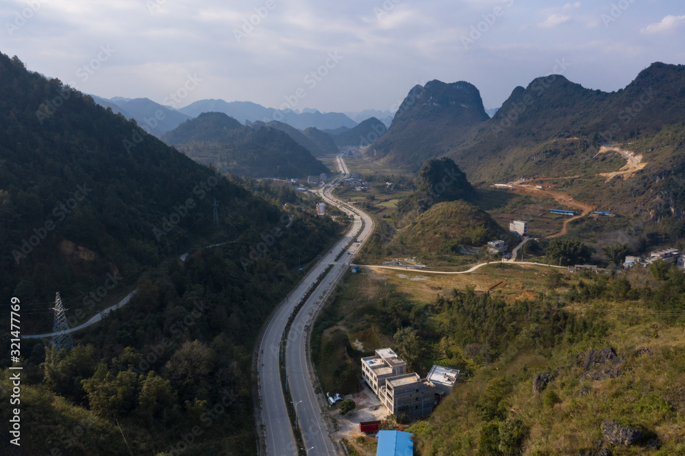 A curved highway between rural valleys