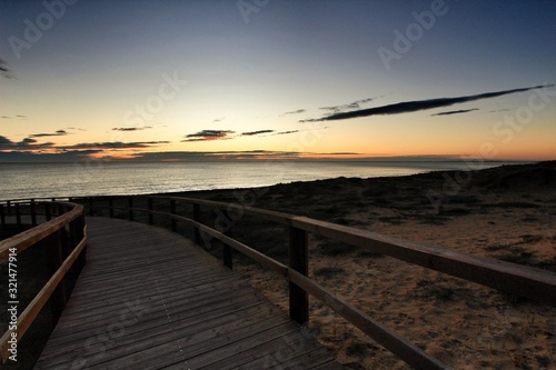 Wooden walkway to the beach at sunrise in Alicante, Spain © SoniaBonet
