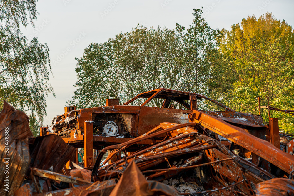 rusted burnt out car wrecks