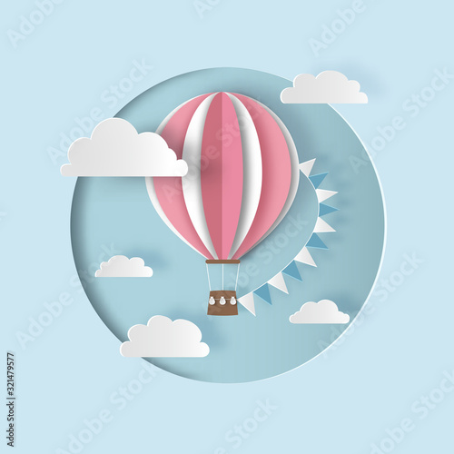 Hot air balloon with bunting flags and clouds. Paper cut style.  Carving art. Vector illustration