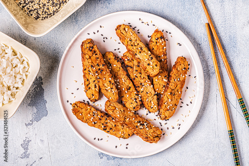 Fried tempeh  with sesame seeds.