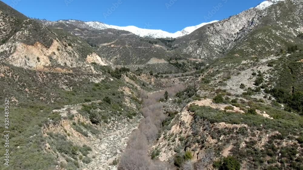 Hyperlapse/timelapse fly up of dry mountain riverbed Hyperlapse/timelapse fly up of dry mountain riverbed