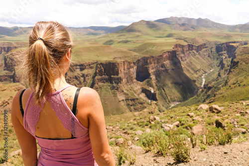 female hiking tourist overlooking the green canyons  photo