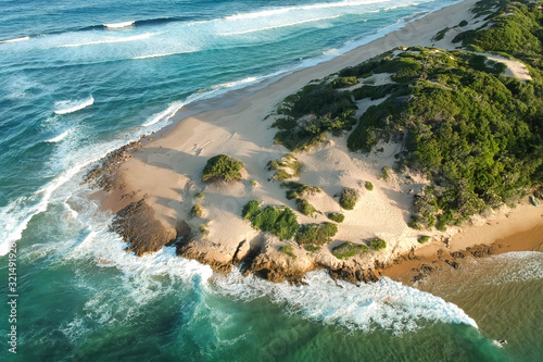 drone shot of a beach on an island