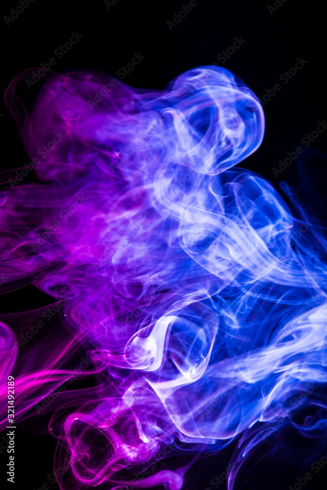 Fototapeta premium Colored smoke on black background