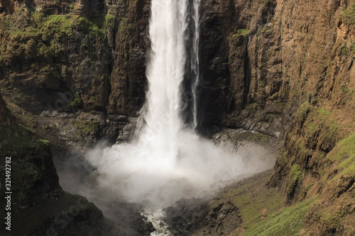 close-up of stunning waterfall running down a steap canyon