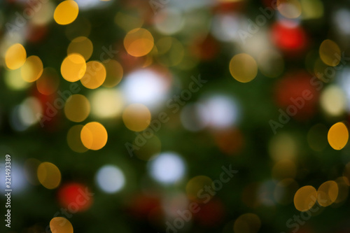 blurred abstract Christmas tree background with lights and toys