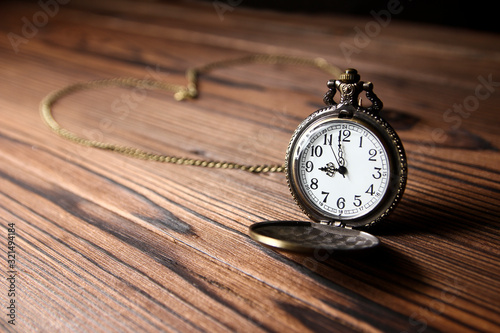 pocket watch on a wooden background