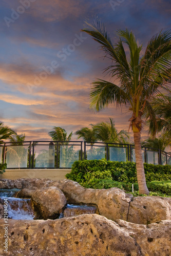 Palm trees and fountains around a luxury hotel property