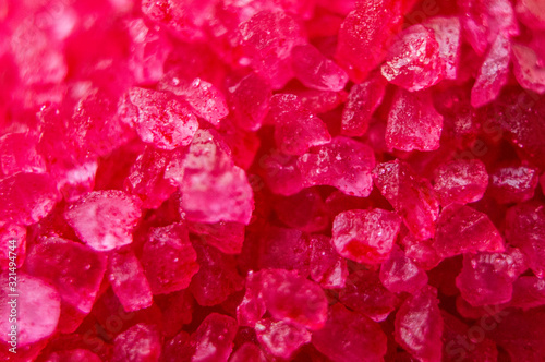 Fototapeta Naklejka Na Ścianę i Meble -  Red crystals minerals bath salts close-up. Macro photo