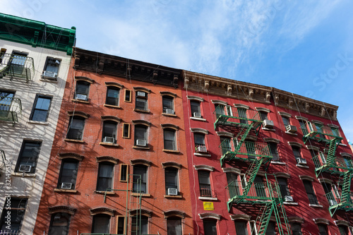 Colorful Old Buildings in Chinatown New York City with Fire Escapes