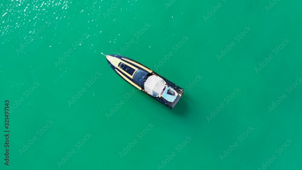 Aerial view of the boat, clear water, coastline, Garda Lake, Italy Aerial view of the boat, clear water, coastline, Garda Lake, Italy