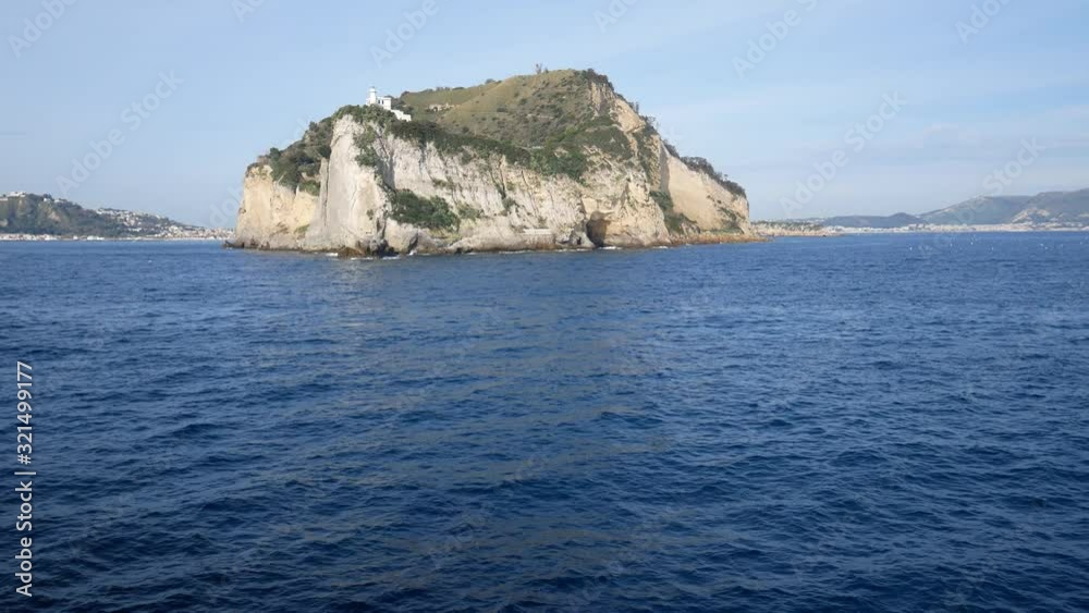 Campi Flegrei, Naples, Campania, Italy: the lighthouse of Cape Miseno seen from the sea. Capo Miseno is the headland on the Bay of Pozzuoli and the Gulf of Naples Campi Flegrei, Naples, Campania, Italy: the lighthouse of Cape Miseno seen from the sea. Capo Miseno is the headland on the Bay of Pozzuoli and the Gulf of Naples