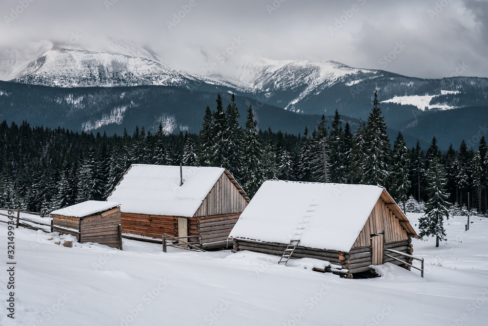 abandoned cabins in snowy winter mountains